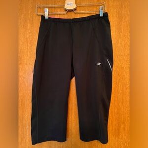 Two pairs of New Balance cropped running tights, size large, black